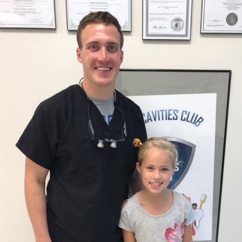 Dentist and child smiling