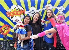 Staff at dressed as super heroes at employee wellness event