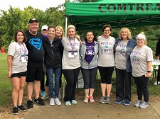 Staff and leadership pictures after a COMTREA 5K fundraiser.